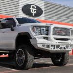 White lifted truck in front of CT Customs building